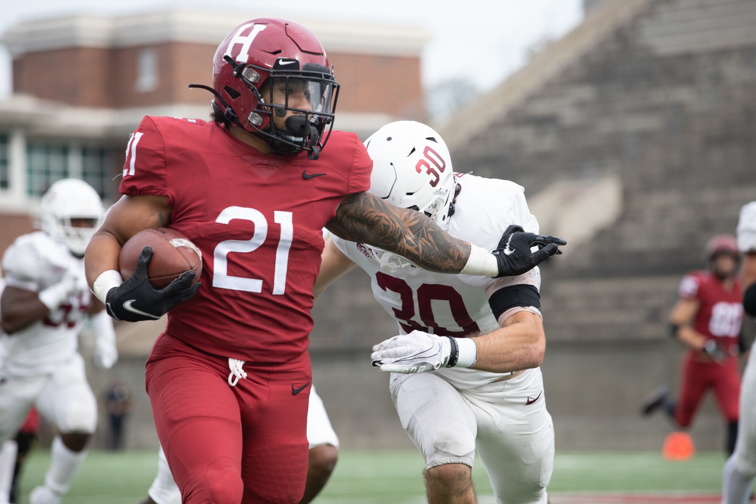 Sophomore running back Aidan Borguet scampers past a Lafayette defender en route to 169 rushing yards and two touchdowns, part of Harvard's 229-yard team rushing attack.