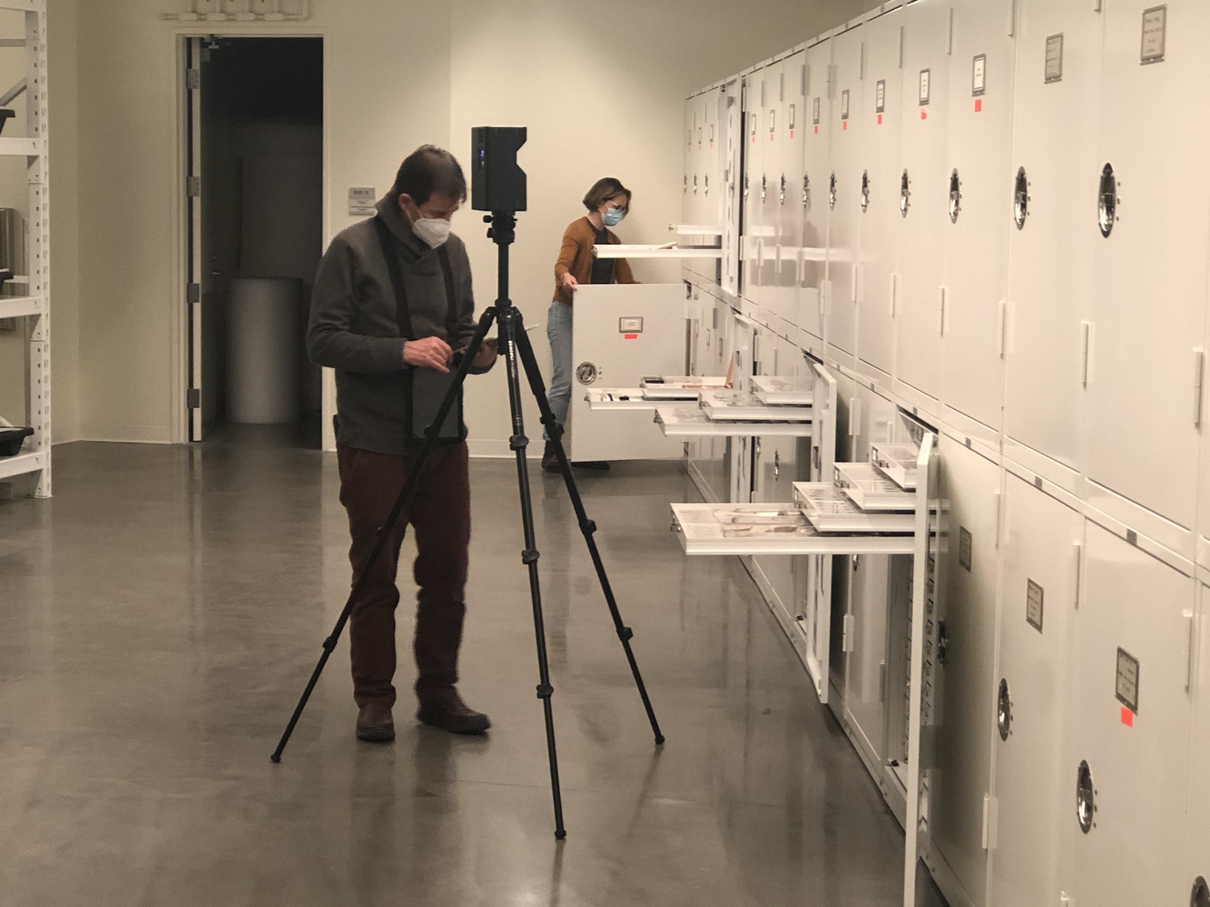 Sean O'Reilly scans the MCZ Paleo Entomology collection with a curatorial assistant.