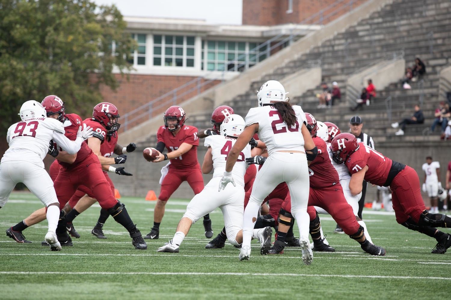 Sophomore quarterback Charlie Dean prepares to hand the ball off to Borguet. Dean threw for 147 yards in the game on 15 completions but was unable to find the end zone, while picking up his first two interceptions of the season.