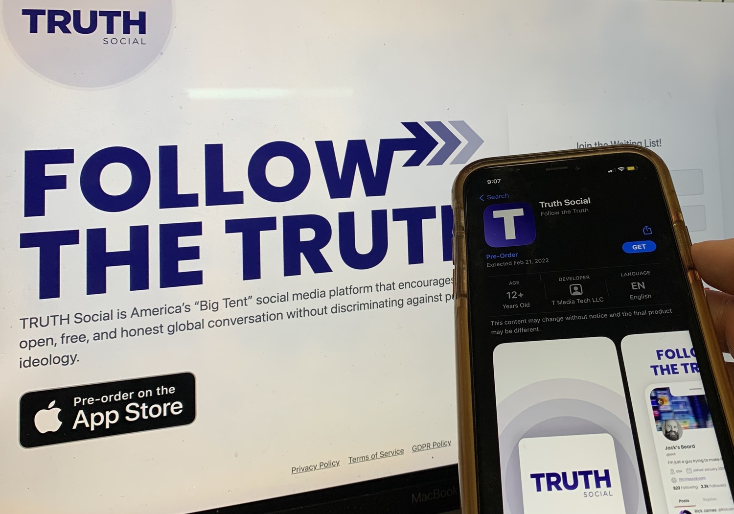 A smartphone user checks the app store for Truth Social.