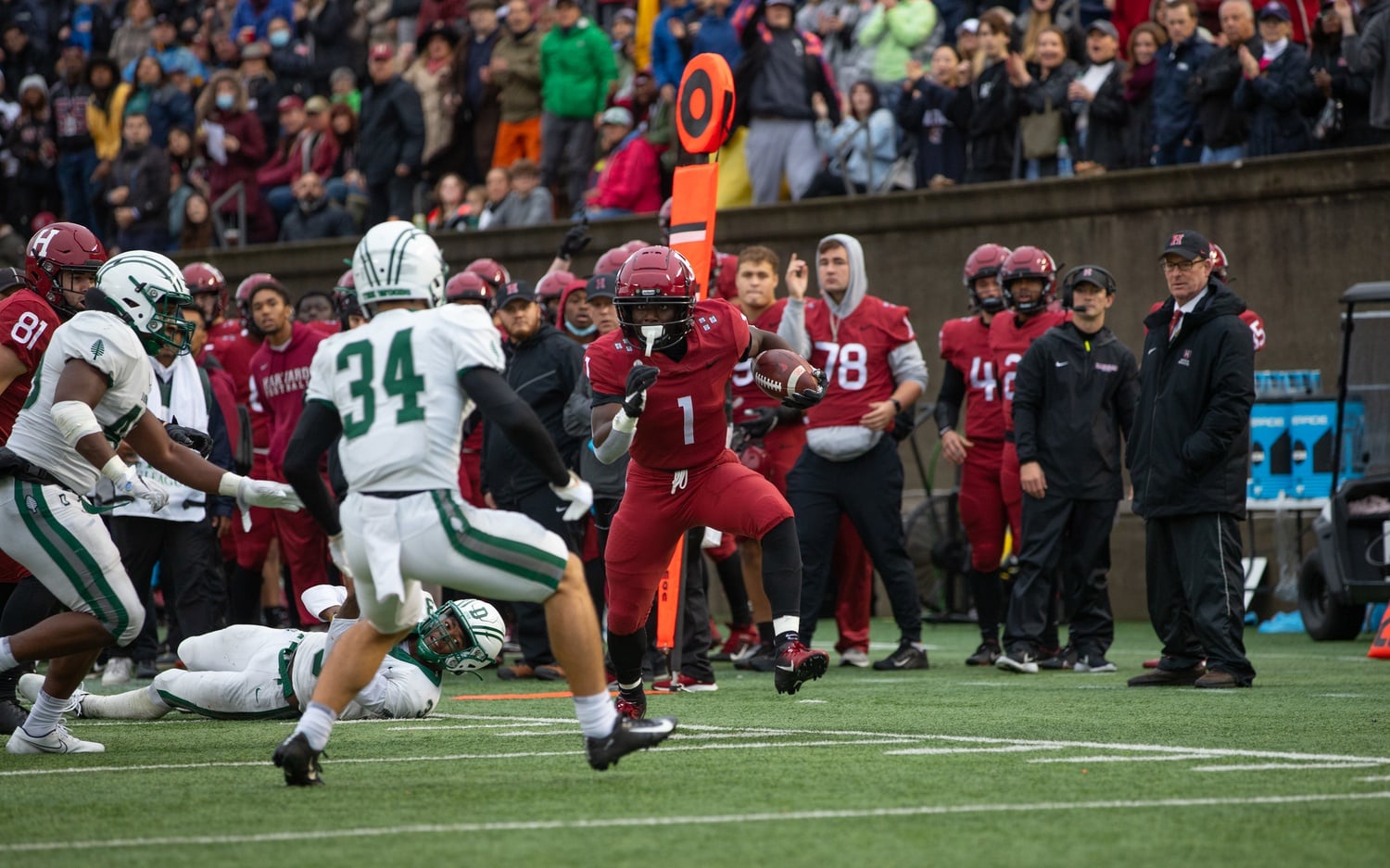 Junior wide receiver Kym Wimberly evades a Dartmouth defender and prepares for contact against another. Wimberly tallied three catches for 19 yards in Saturday's contest.