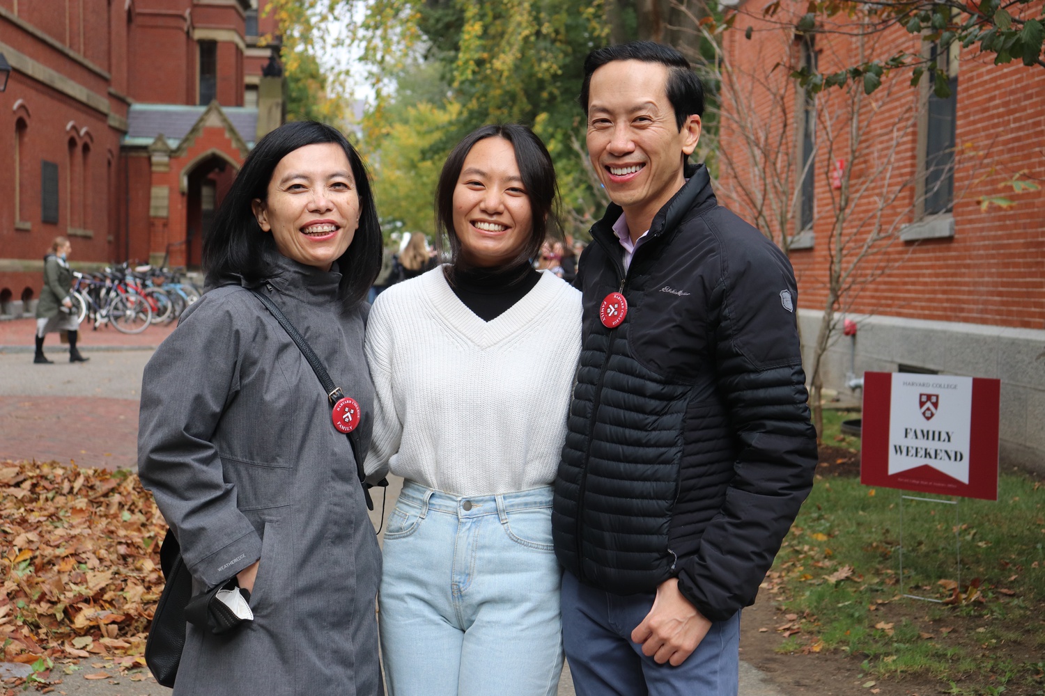 Catie Thai '25 with her parents in Harvard Yard Friday.