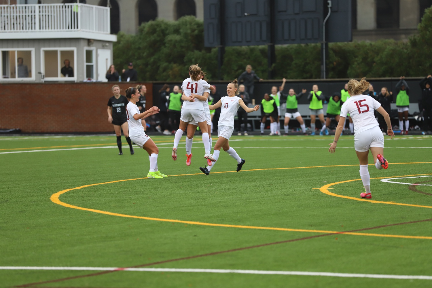 First-year forward Ainsley Ahmadian (#43) and first-year midfielder Hannah Bebar (#41) leap up in celebration of one of Harvard's goals in its 3-1 victory over Dartmouth on Saturday.