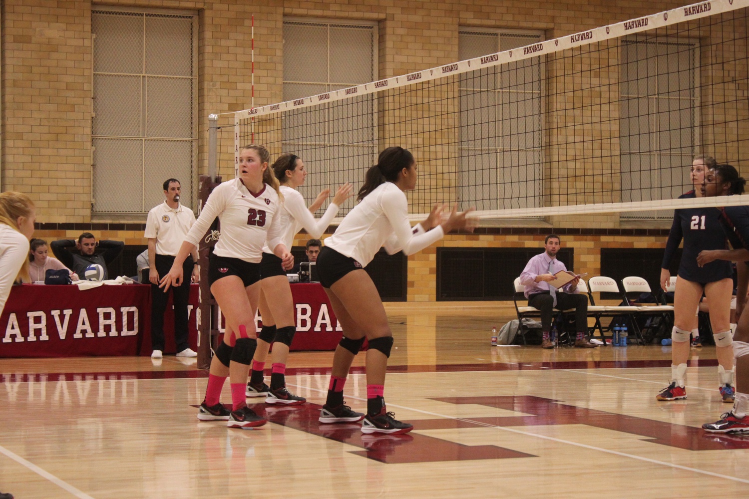 Harvard’s front line communicates and works together during its third and fourth set rallies against Penn.