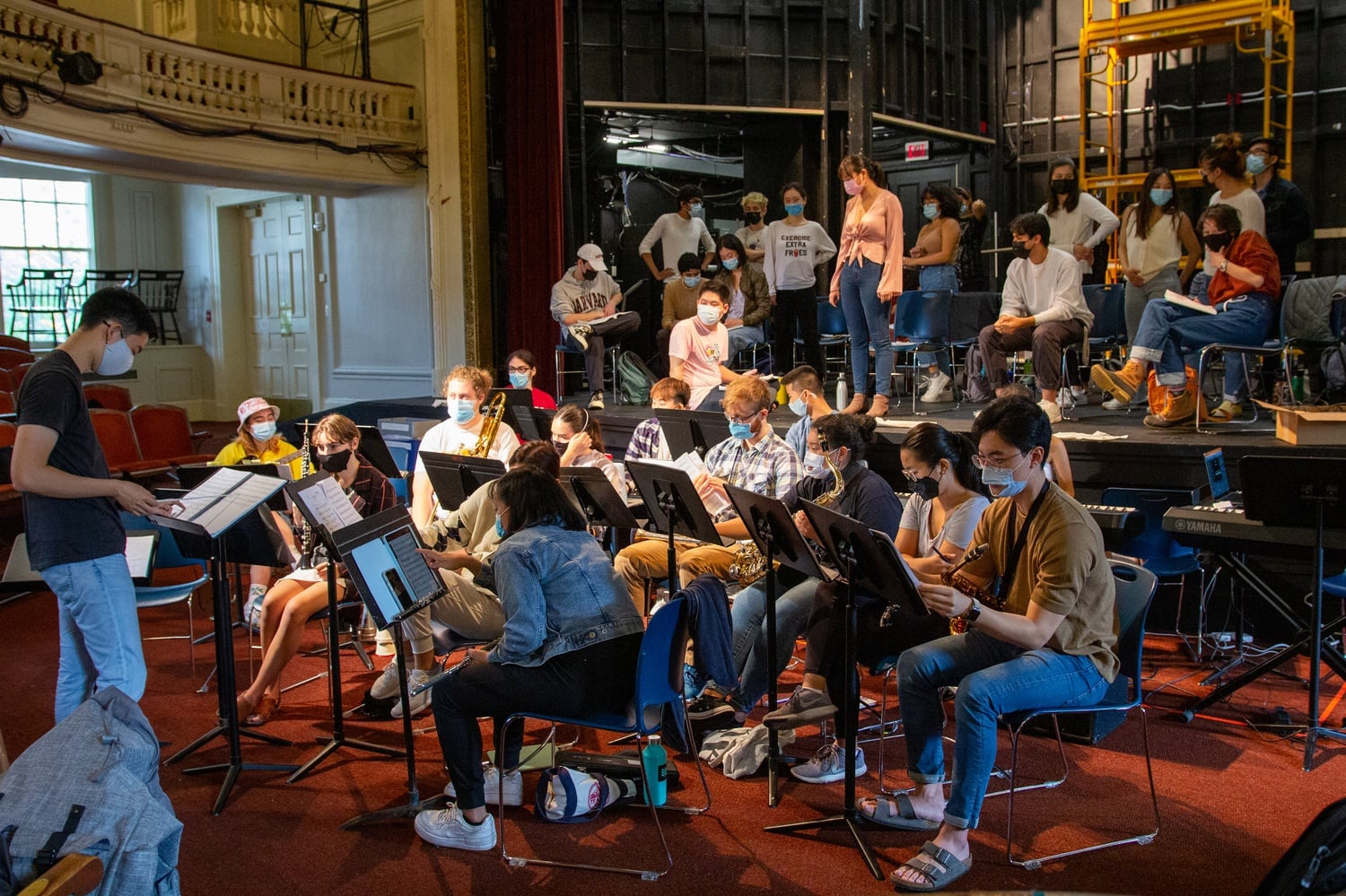 The cast and pit orchestra of “Legally Blonde” rehearsing in the Agassiz Theatre.