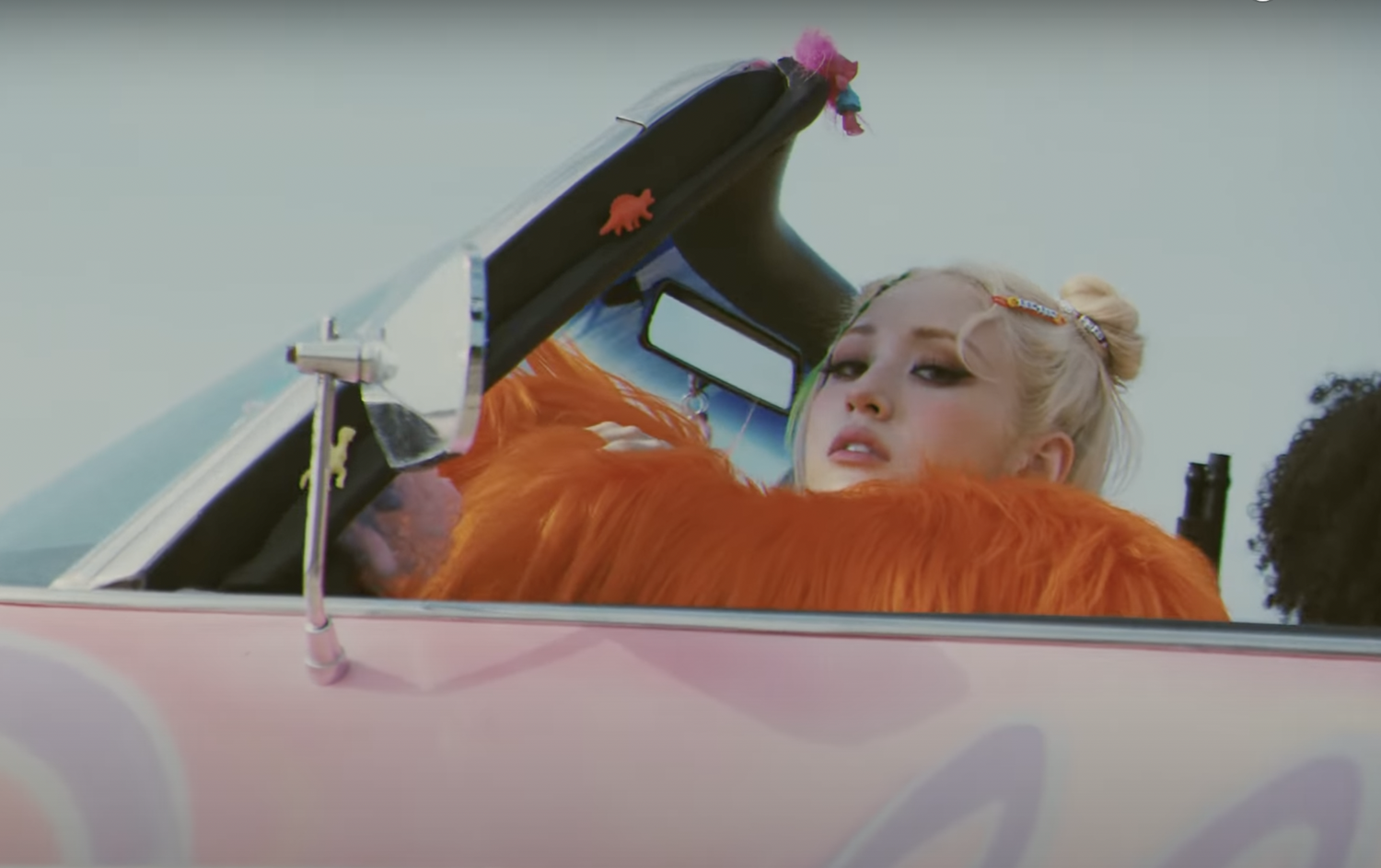 The music video for Somi's latest single “XOXO” presents her in a more rebellious light.