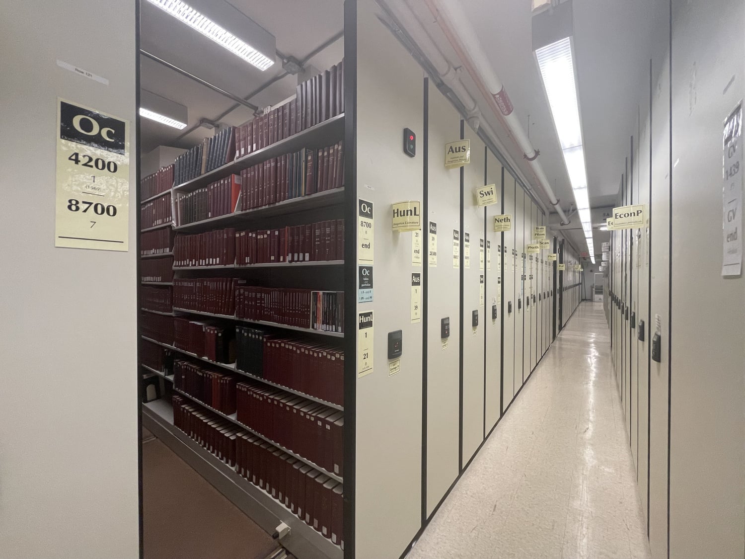 A corridor in Pusey Library Level P3. The Oceania archives section is opened on the left.