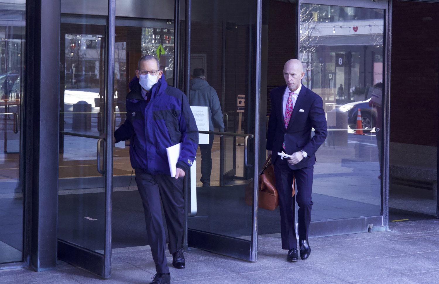 Former Harvard Chemistry chair Charles M. Lieber (left) and his lawyer, Marc Mukasey, exit the John J. Moakley United States Courthouse in Boston on Tuesday.