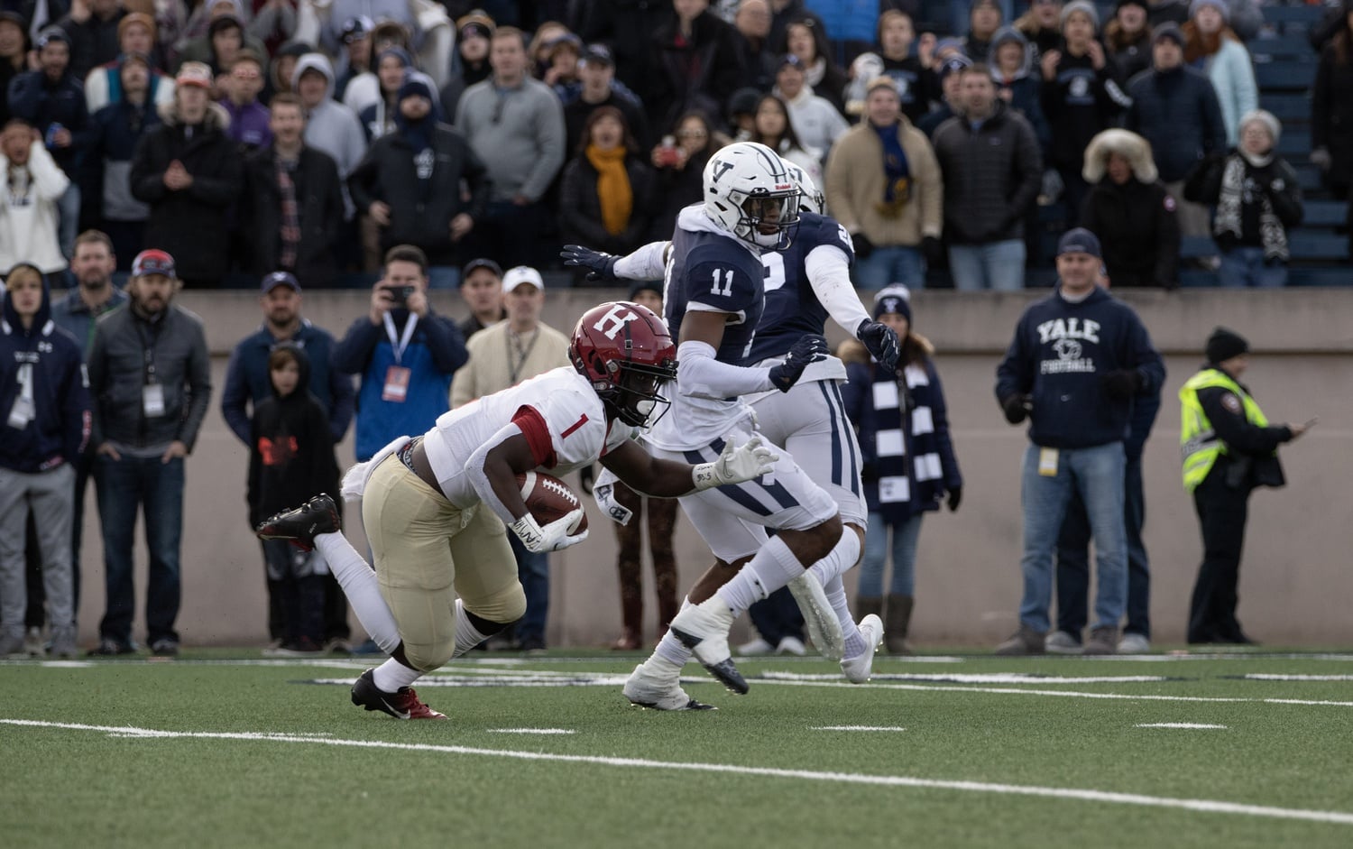 Junior wide receiver Kym Wimberly produces a 42-yard catch and run that would set up his game-winning touchdown against Yale on Nov. 20, 2021. Wimberly will return to Harvard for his senior season.