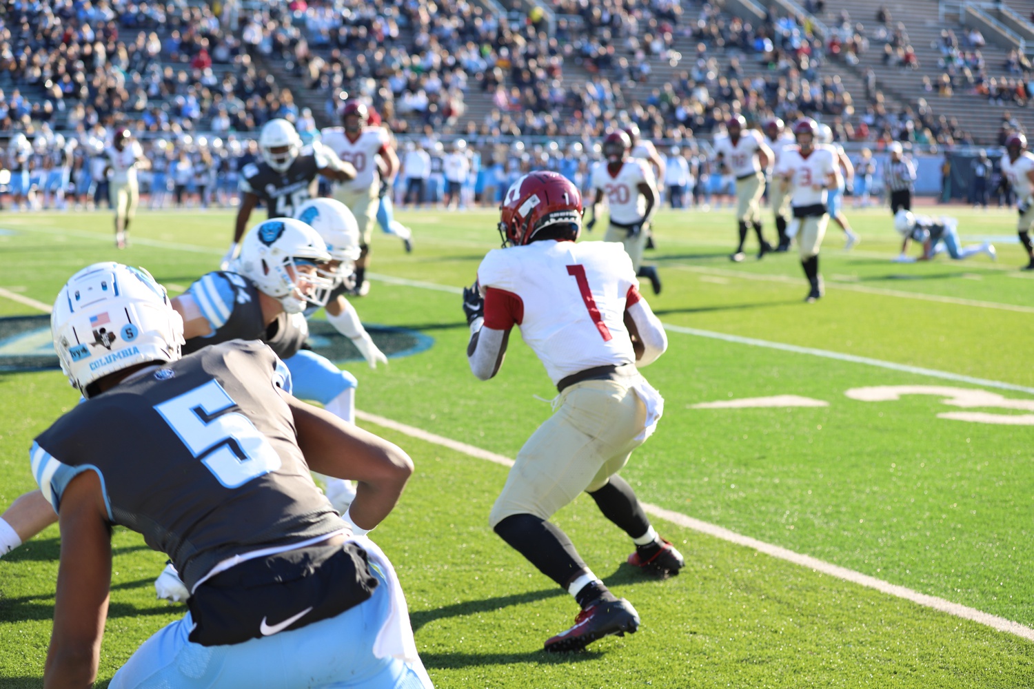 Junior wide receiver Kym Wimberly evades defenders in a 49-21 victory over Columbia on Nov. 6, 2021. He torched the Lions for 7 catches, 111 yards, and a touchdown.