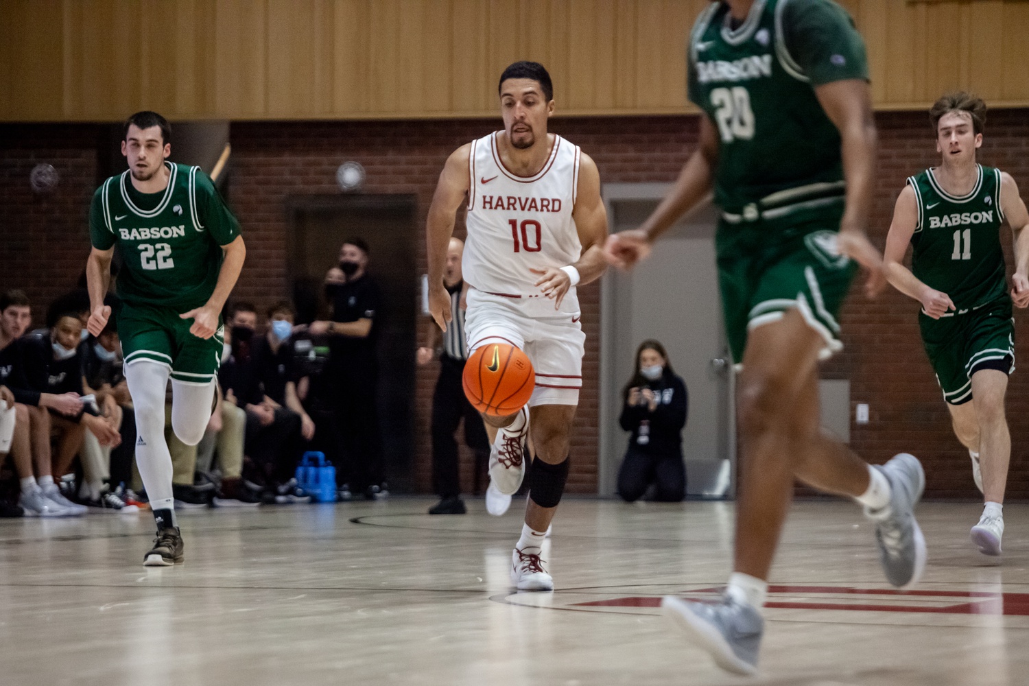 Senior guard Noah Kirkwood dribbles up the court in a 74-64 victory over Babson on Dec. 6. In Friday's win against Brown, Kirkwood scored 11 points.