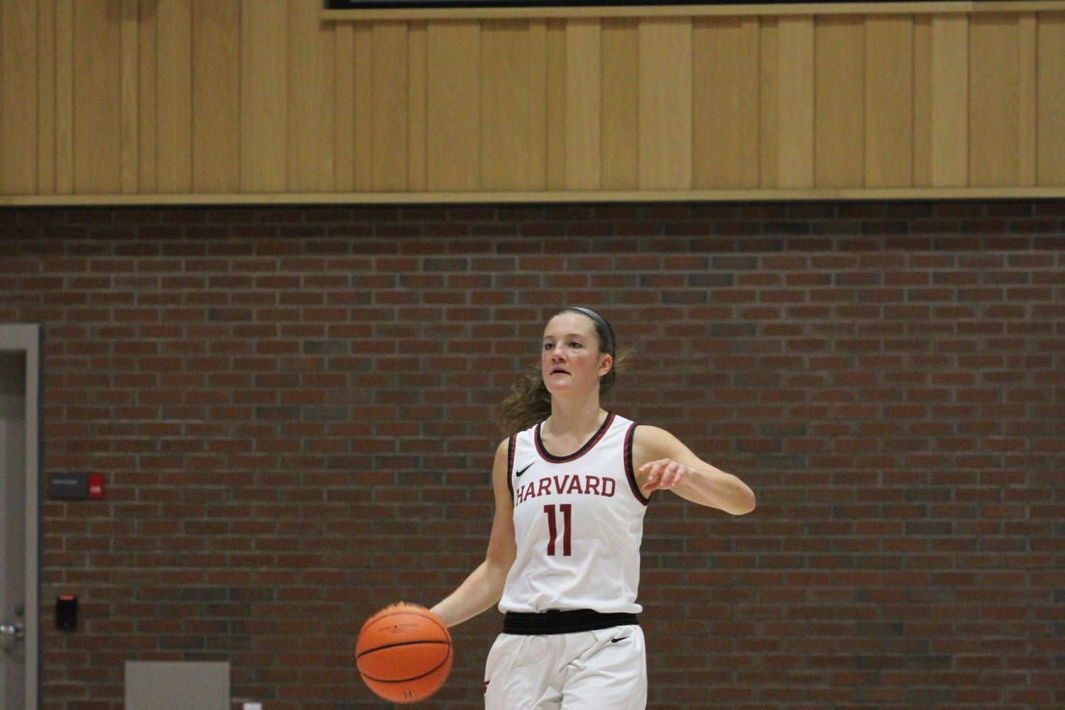 Junior guard Maggie McCarthy dribbles up the court in a 99-75 victory over Merrimack on Nov. 30. McCarthy contributed 14 points and 14 rebounds over the course of the conference wins this past weekend.
