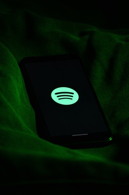 Cover image for Spotify logo on phone