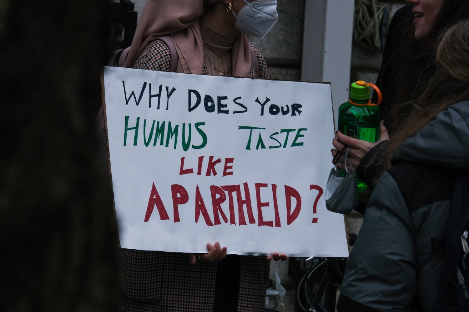 Students gathered in front of Massachusetts Hall Tuesday protest Harvard's use of Sabra products in their dining halls.