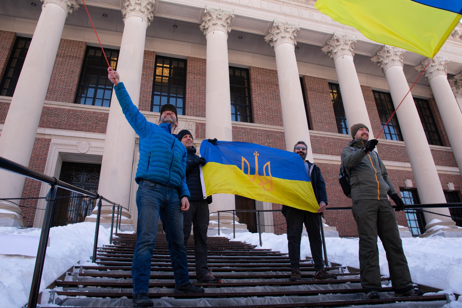 Demonstrators held Ukrainian flags last weekend at a rally condemning Russia’s invasion of the country.
