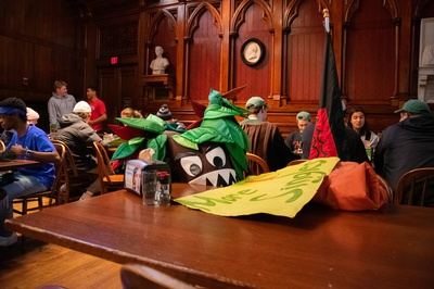 Cover image for Currier Mascot and Poster Sit in Annenberg Post Dorm-Storming