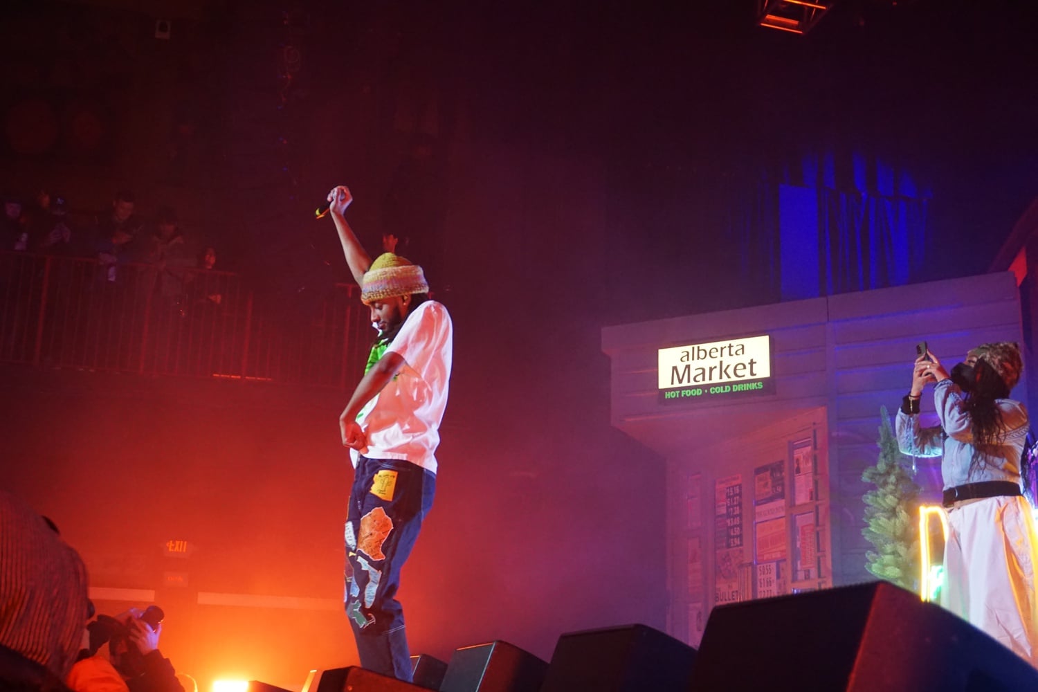 Aminé dances on stage.