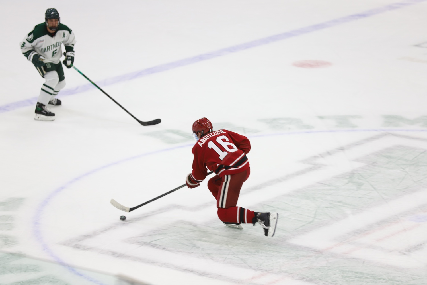 Abruzzese drives the puck down the ice against Dartmouth in October 2021.