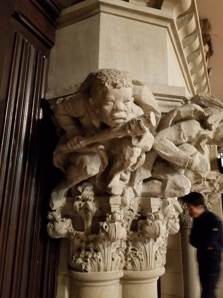 A close-up shot of the “savage” figure holding a club on the left pillar of the fireplace. Amelia Y. Goldberg, a senior then living in Westmorly Court, took this photo in October 2018.