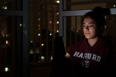 Cover image for Harvard student on phone