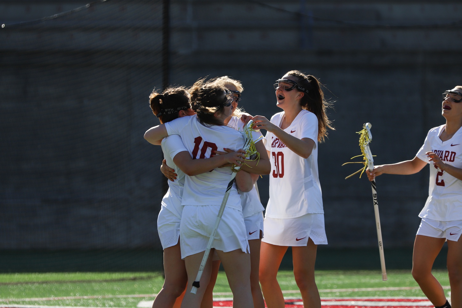 The Crimson celebrate after a goal during a 15-14 loss to Columbia on April 6, 2019. Three years later, Harvard exacted revenge with a 14-8 victory in New York City.