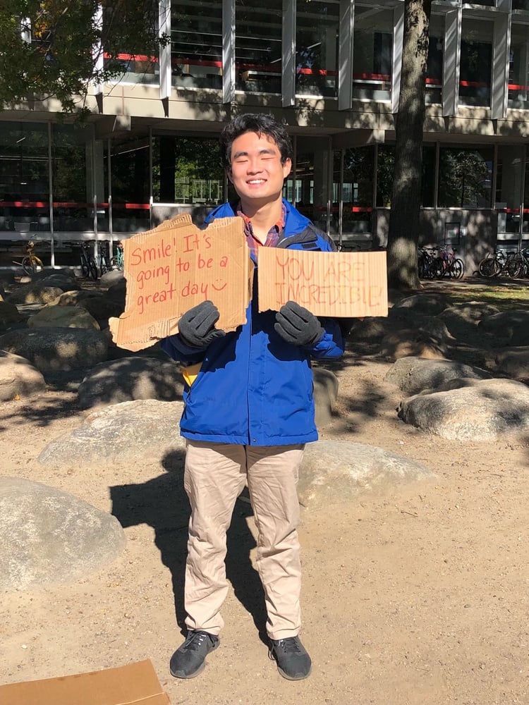 In his freshman fall, Michael stood in the Science Center Plaza offering free hugs to passersby.