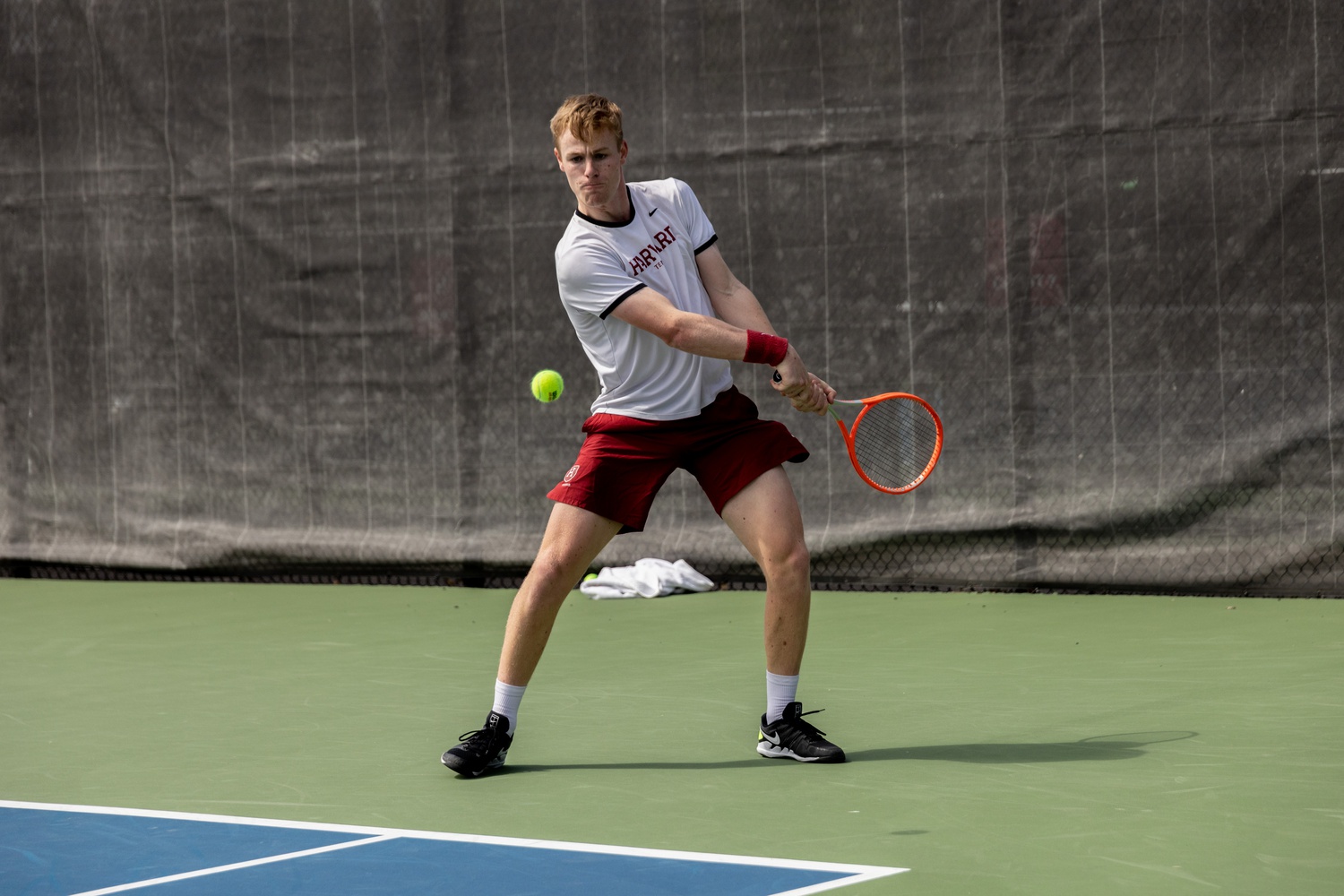 Sophomore star Henry von der Schulenberg prepares to connect on a backhand strike in Harvard's victory over Princeton on April 16.