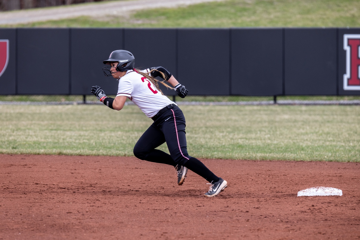 Junior infielder/outfielder Trina Hoang races out of the box during an 8-2 victory over Penn on April 9, 2022. This past weekend, Hoang helped the Crimson to a 2-1 series victory over Brown that kept it in contention for a conference title.