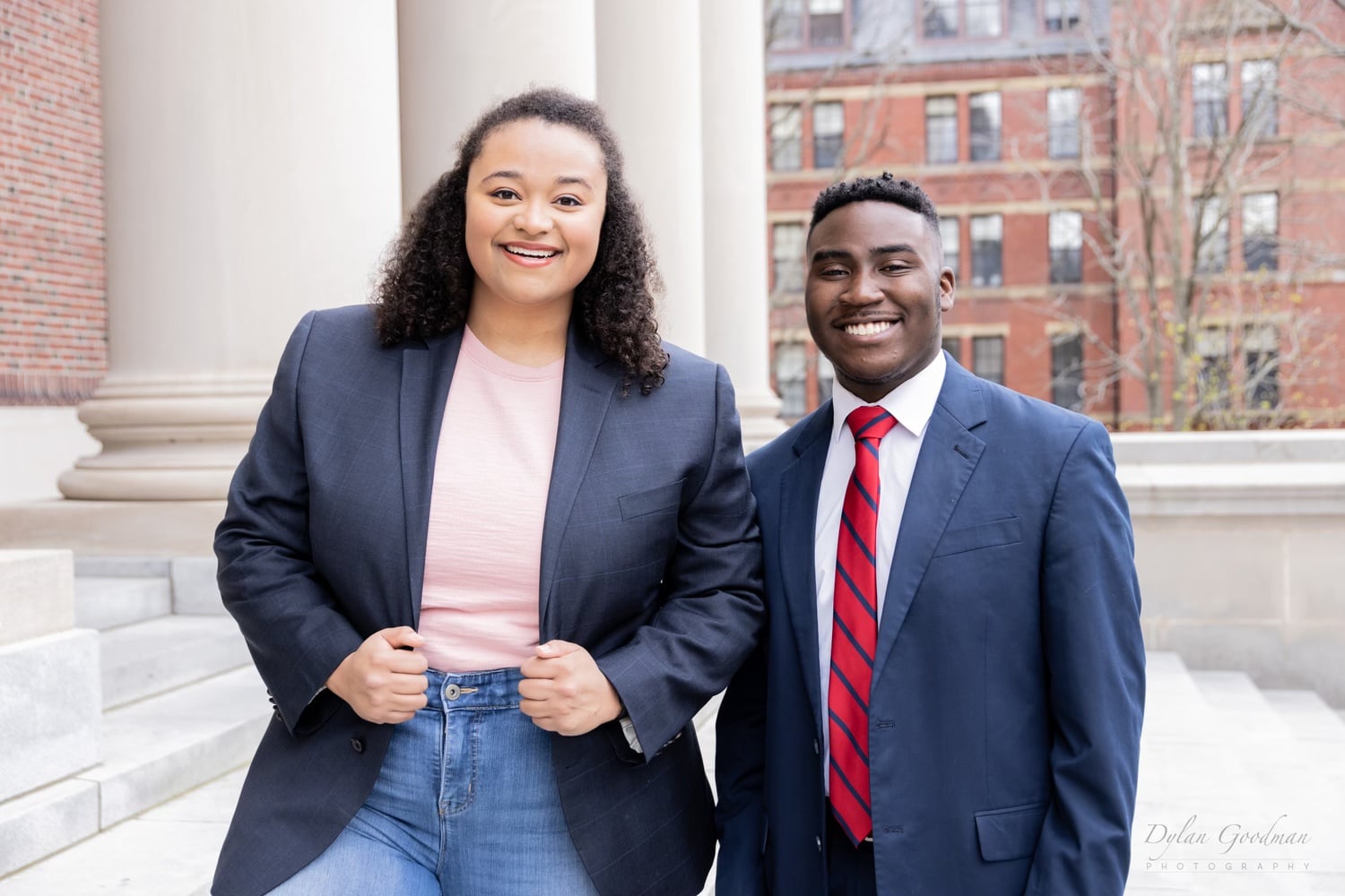 LyLena D. Estabine ’24 and Travis Allen Johnson ’24, pictured together on the steps of Widener Library