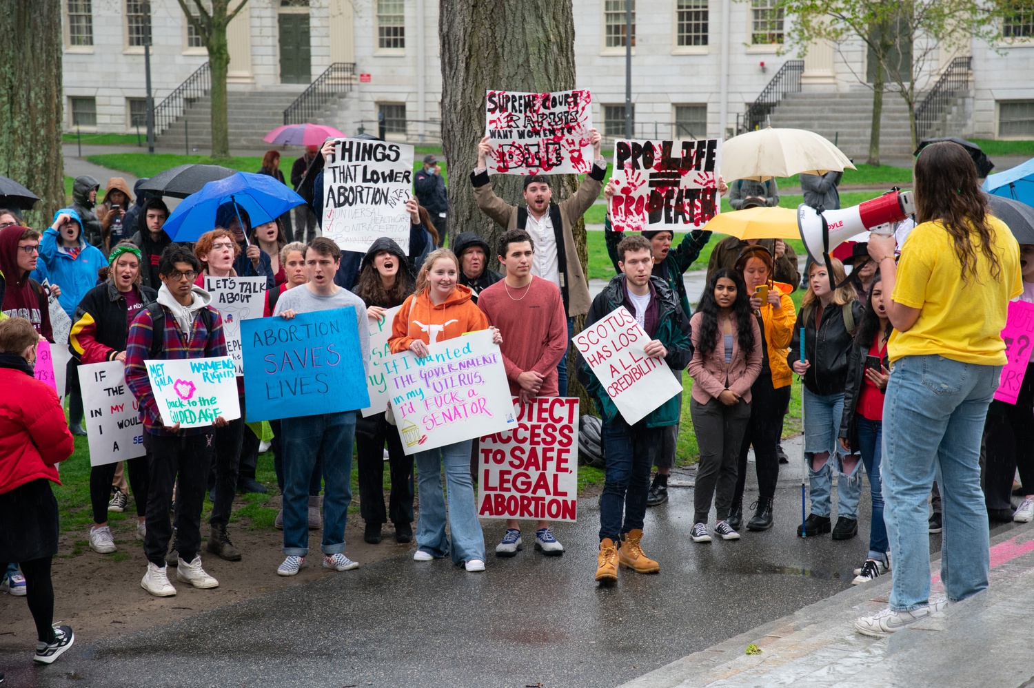 Elizabeth M. Benecchi leads a rally in support of abortion rights on the steps of Memorial Church Wednesday.