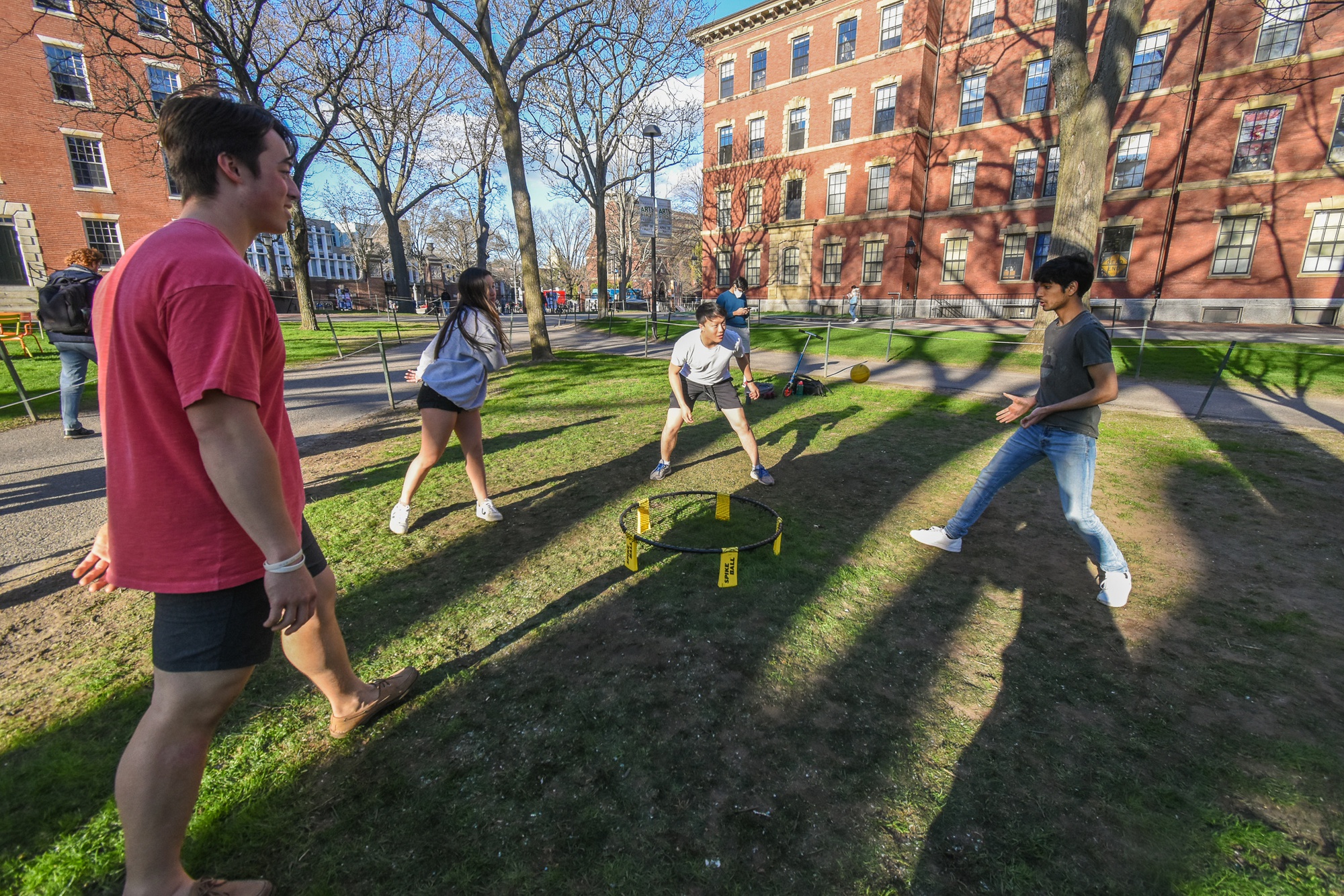 Students celebrate a return to non-frigid temperatures with a game of spikeball.