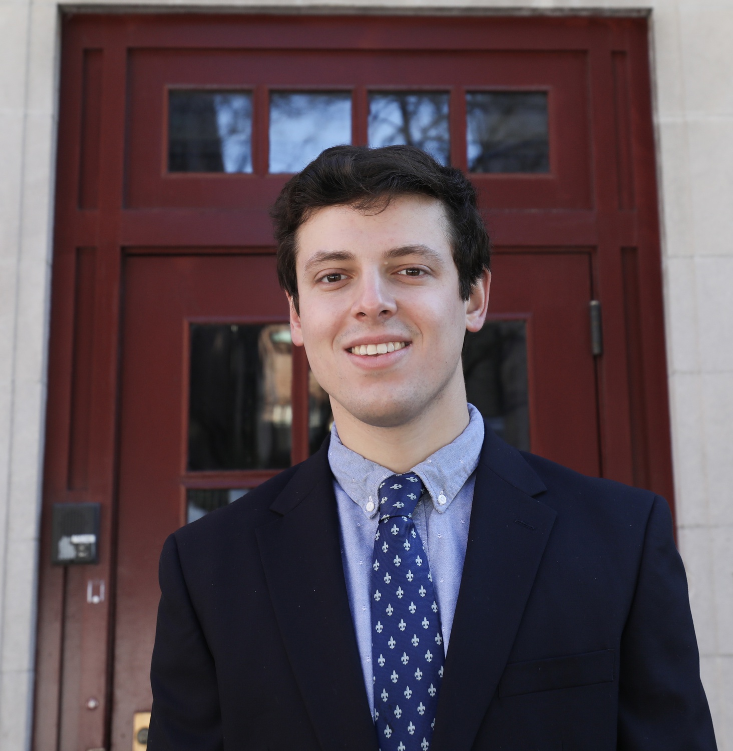 Former sports chair William C. Boggs poses in front of the Crimson office for a portrait in December 2021. Boggs, a two-year chair, also wrote about the men's ice hockey team while at Harvard.