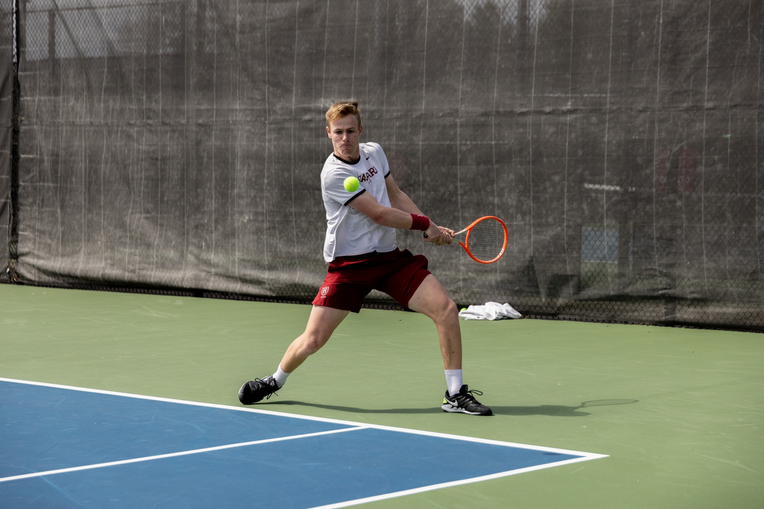 Harvard sophomore star tennis player Henry von der Schulenberg whips a backhand during a 5-2 victory over Princeton on April 16. Von der Schulenberg was a breakout star for the Ivy League champs.