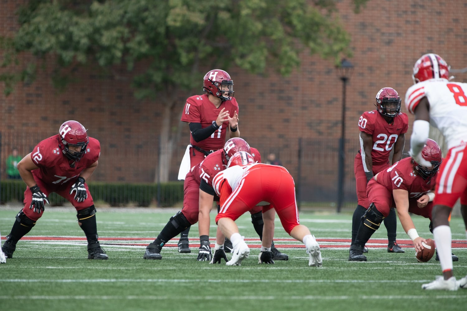 Senior quarterback Charlie Dean prepares to throw in a 24-10 victory over Cornell on Oct. 9, 2021. Dean will be the starter for Tim Murphy's squad when the Crimson opens its season on Friday night against Merrimack.