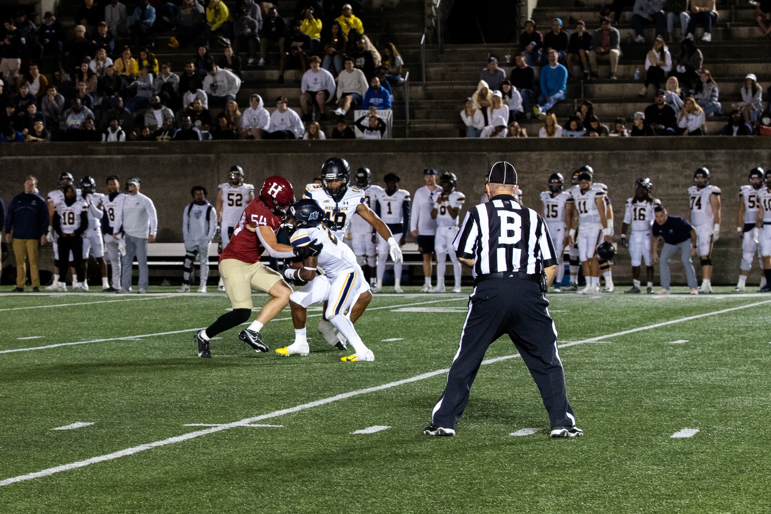 Senior linebacker Jack McGowan makes a tackle in the 28-21 overtime victory over Merrimack. The defense was critical in the win, ultimately holding the Warriors to -26 net rushing yards.