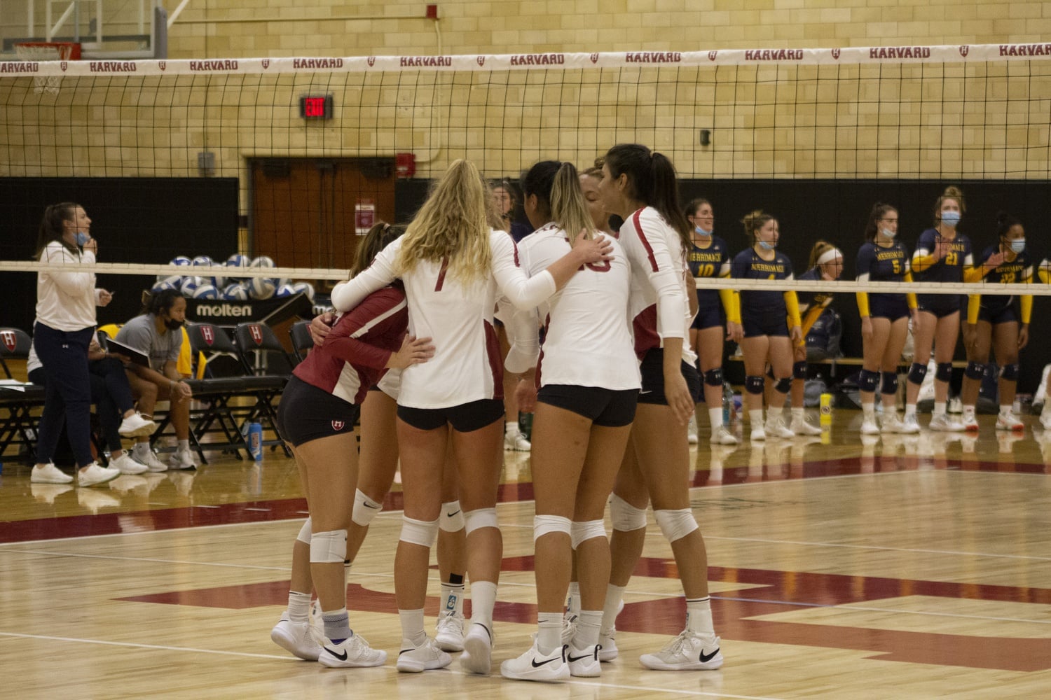 The Crimson celebrates after a point last year against Merrimack, who they beat in four sets. Harvard will not face the Warriors this year, with only Ivy League opponents ahead for the rest of the season.
