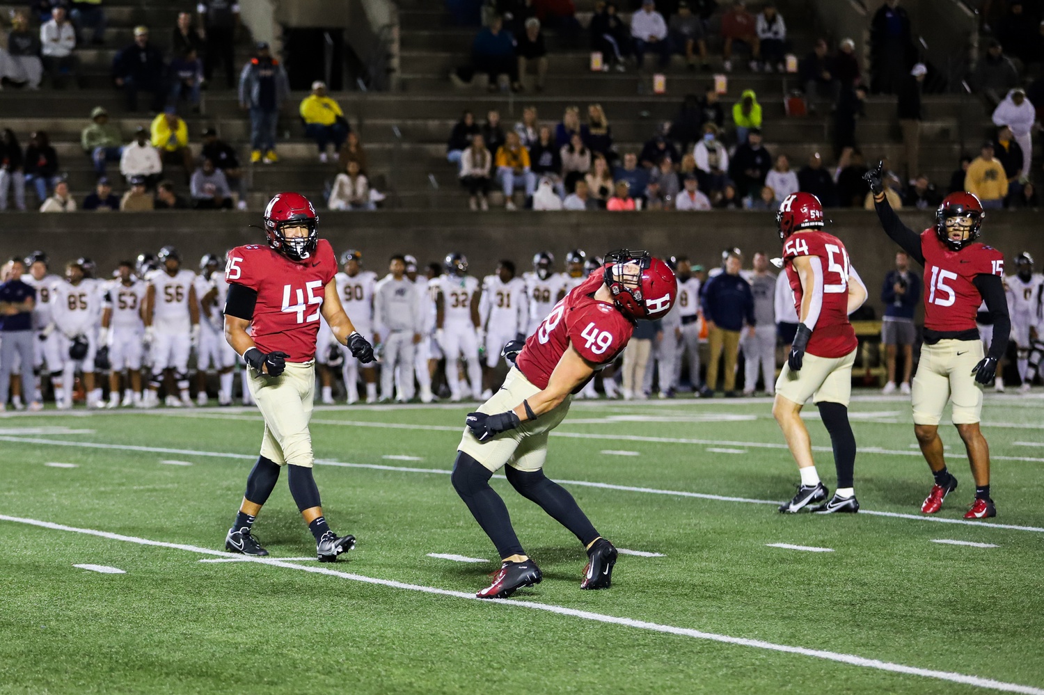 Junior linebacker Matt Hudson celebrates a sack in last Friday's 28-21 overtime victory over Merrimack. Hudson and the Crimson, after sacking Warriors signal-caller Jack Zergiotis nine times, will hope to find similar success against the Bears' Jake Willcox.