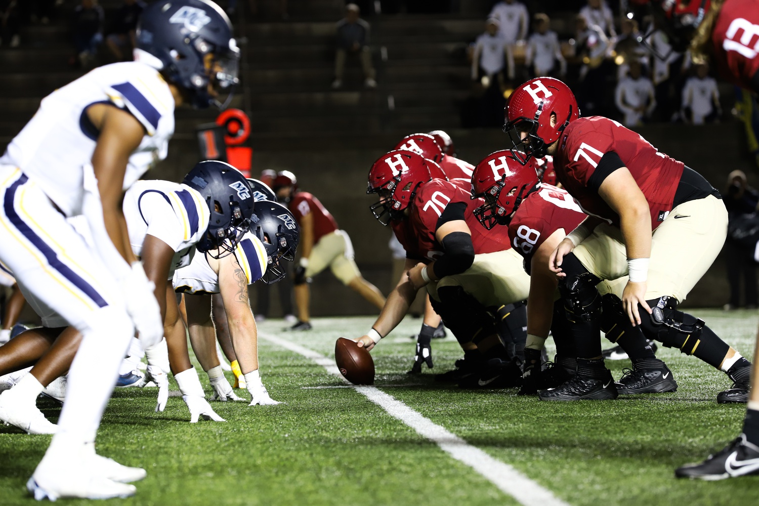 Senior offensive lineman Scott Elliott prepares to snap the ball to senior quarterback Charlie Dean in Friday's win over Merrimack. Elliott and the offensive line will be charged with protecting Dean and opening up holes for senior running back Aidan Borguet on Saturday.
