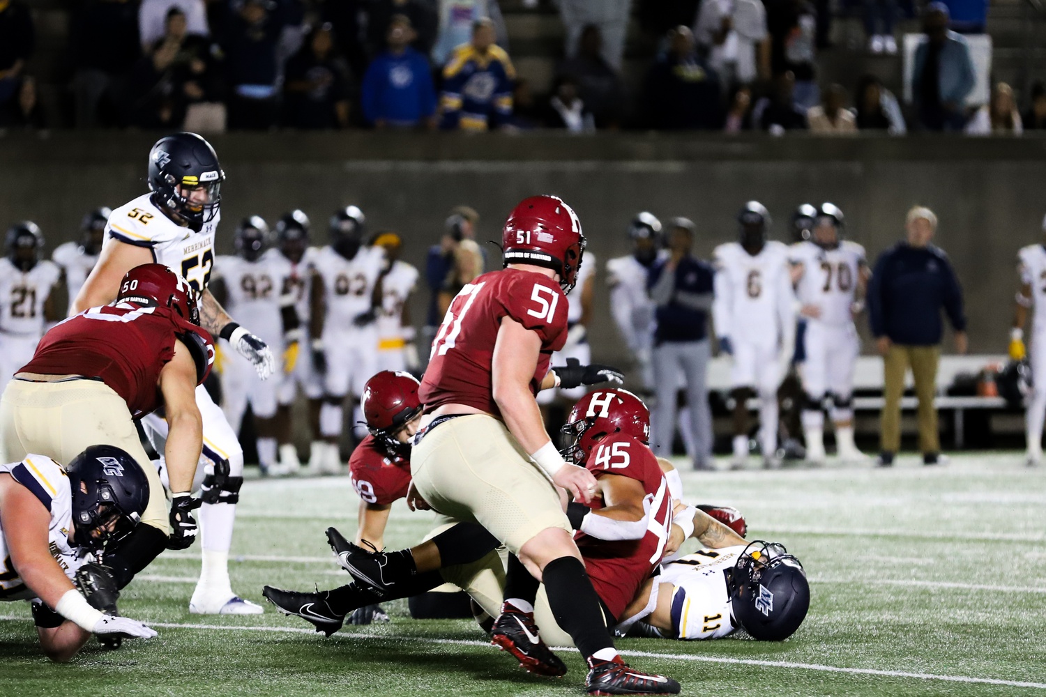 Senior defensive lineman Nate Leskovec (51), junior defensive tackle Thor Griffith (50), junior linebacker Matt Hudson (49), and senior linebacker Jake Brown (45) in a 28-21 (OT) win against Merrimack on Sept. 16. All four defensive players were critical in holding Cornell to just 65 yards on the ground on Friday.