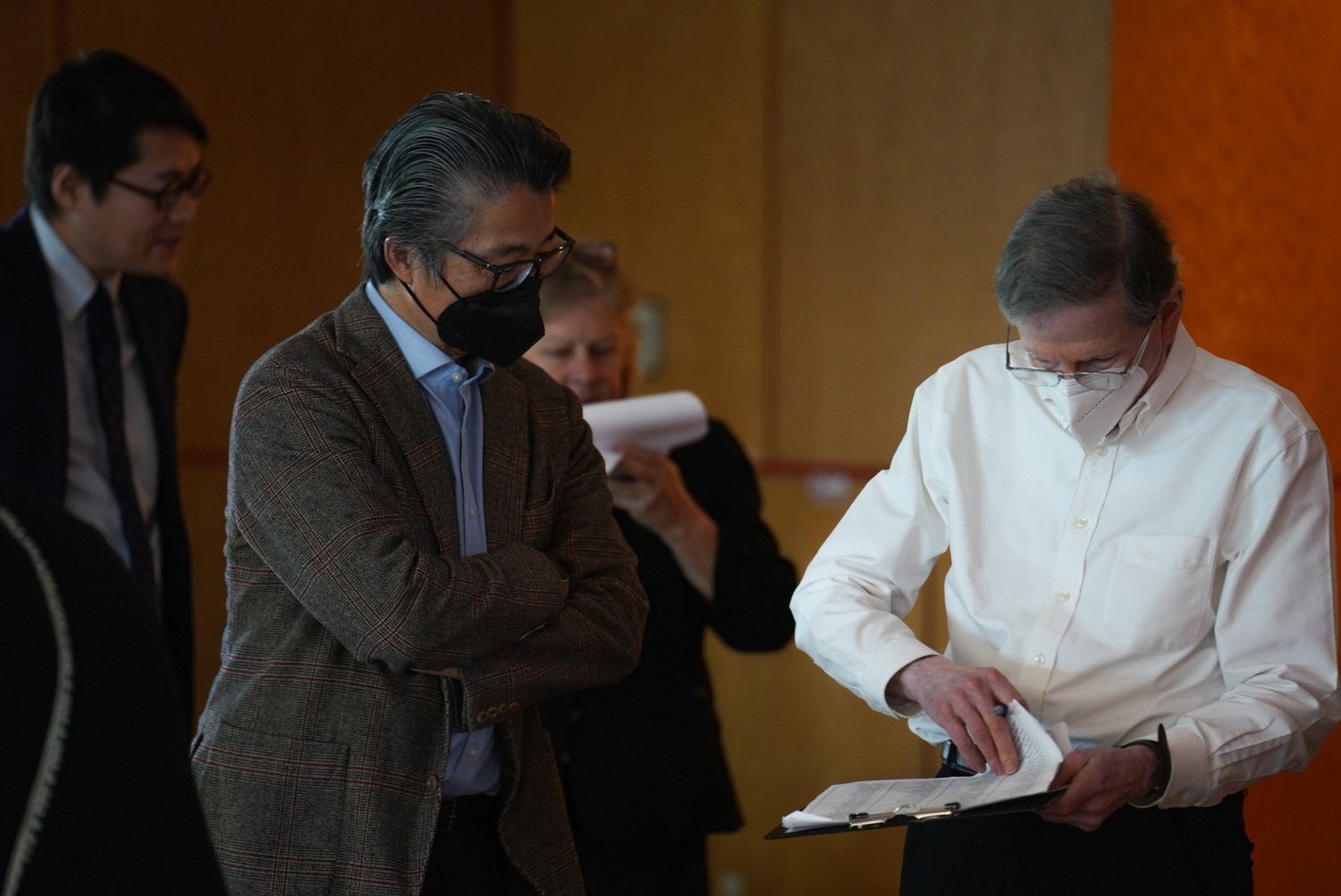 Harvard professor Taeku Lee checks in before entering his first Faculty of Arts and Sciences meeting since he was hired over the summer.