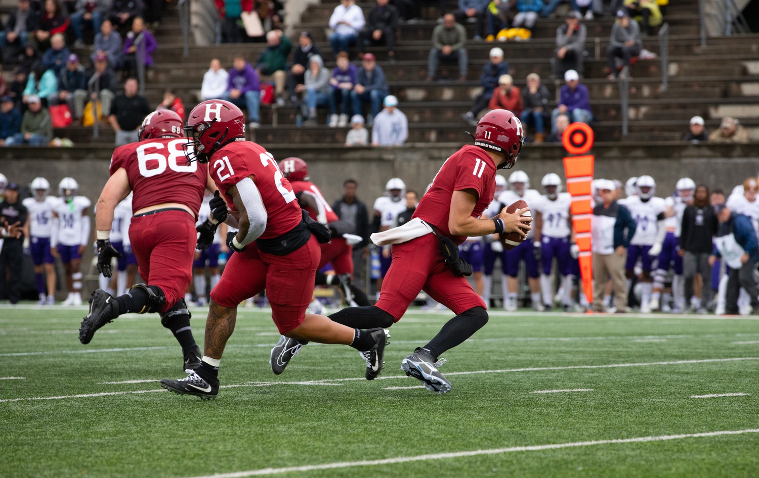 Senior quarterback Charlie Dean and senior wide receiver Aidan Borguet execute a play-action fake in the 30-21 loss to Holy Cross on Oct. 1. Dean and Borguet's performances will be crucial on Saturday in Washington D.C.