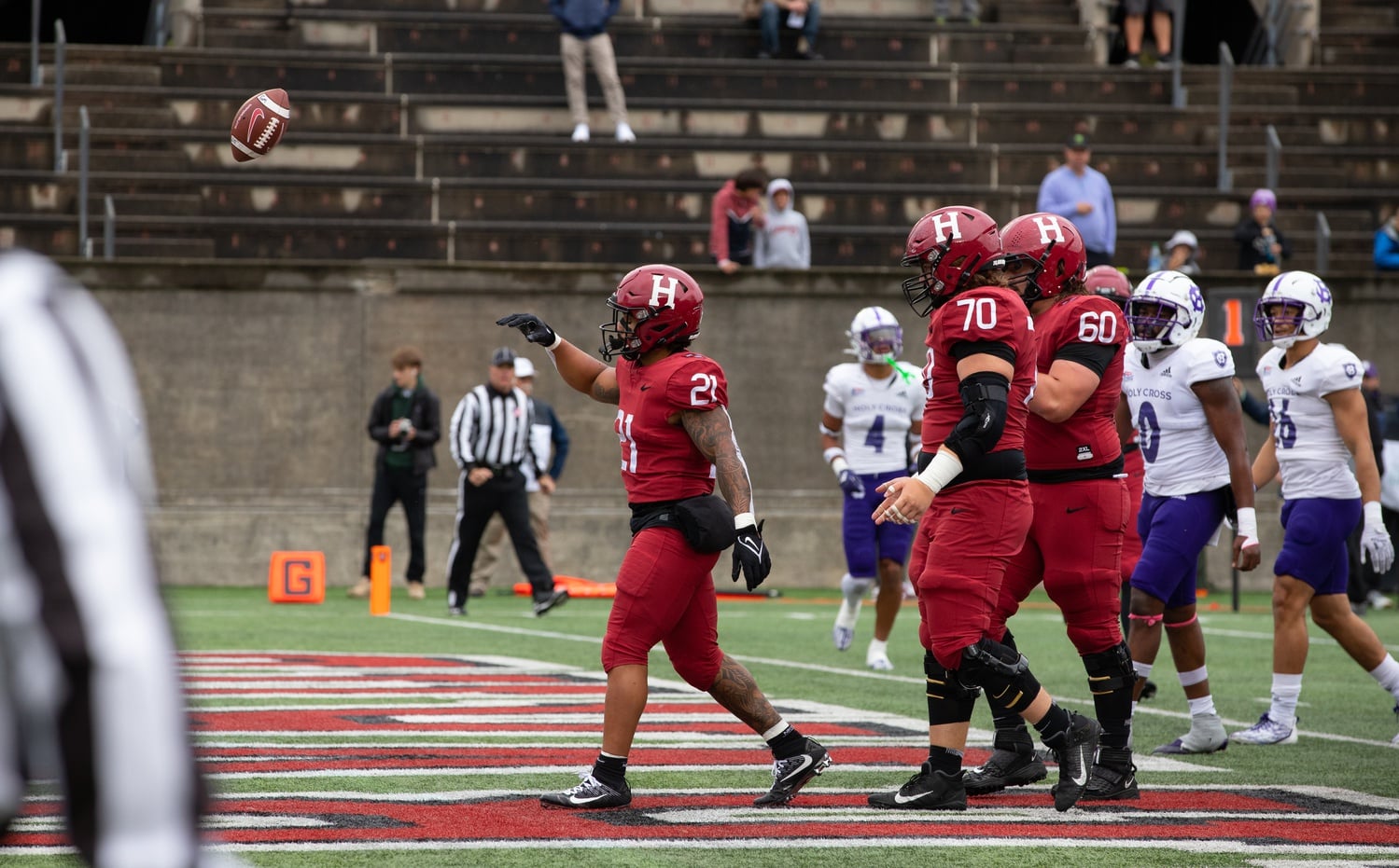 Senior running back Aidan Borguet flings aside the football in celebration after a touchdown in a 30-21 loss to Holy Cross on Oct. 1. Borguet scored his seventh rushing touchdown of the season in Saturday's win.
