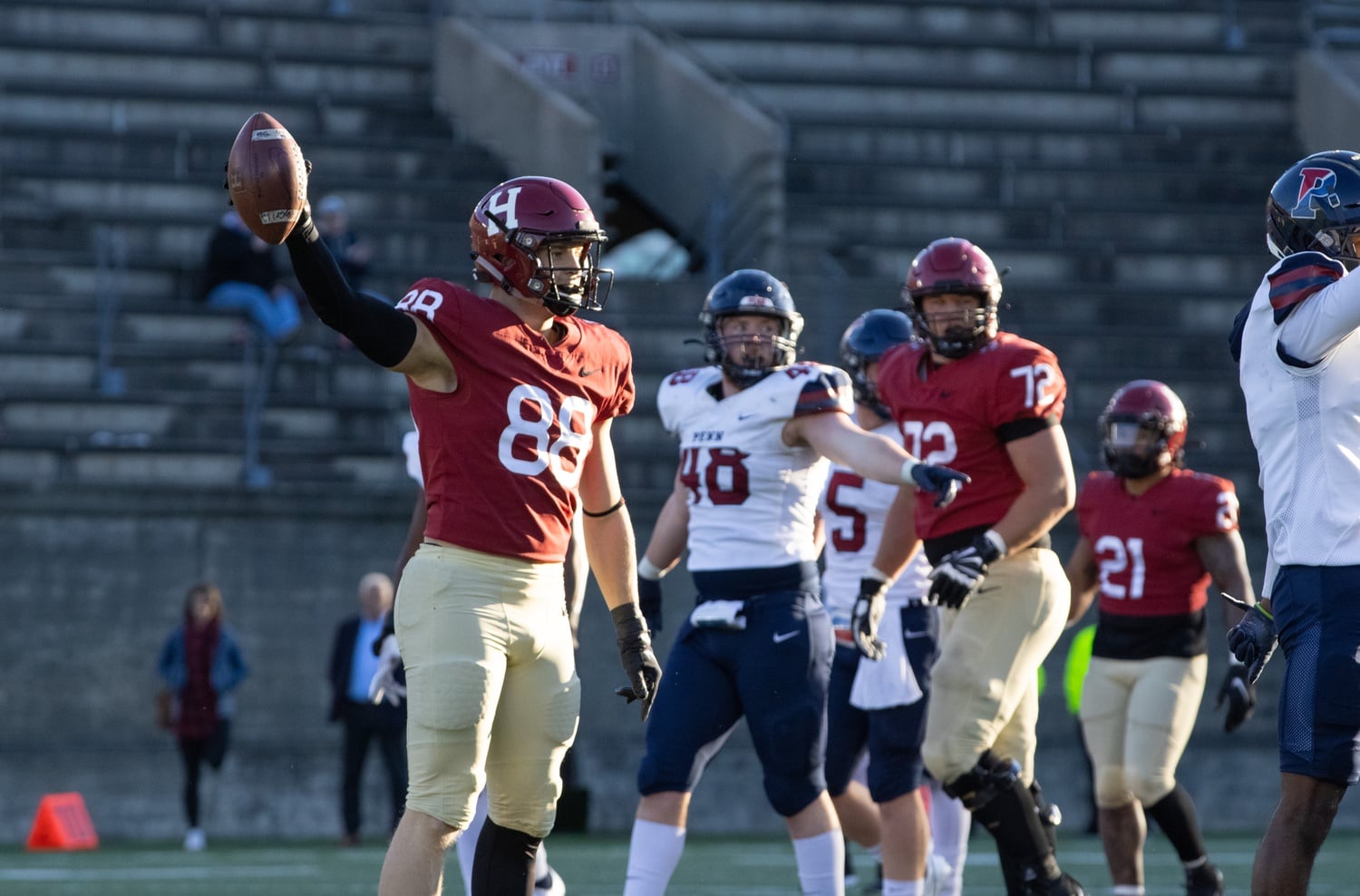 Junior tight end Tyler Neville signals for a first down in a 23-7 victory over Penn on Nov. 13, 2021. Neville has broken out in his last two games, and his success will be critical against a Princeton team that is elite at snuffing out the run.