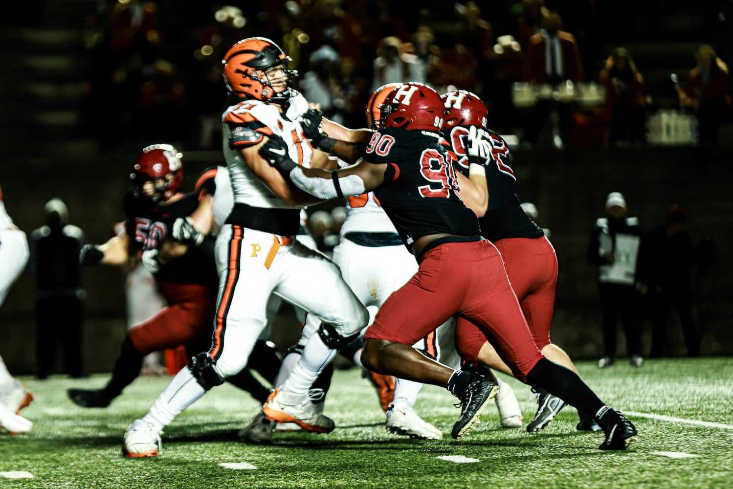Senior defensive lineman and captain Truman Jones grapples with a Princeton offensive lineman in Harvard's 37-10 loss on Friday. Jones recorded one of the Crimson's two sacks in the loss.