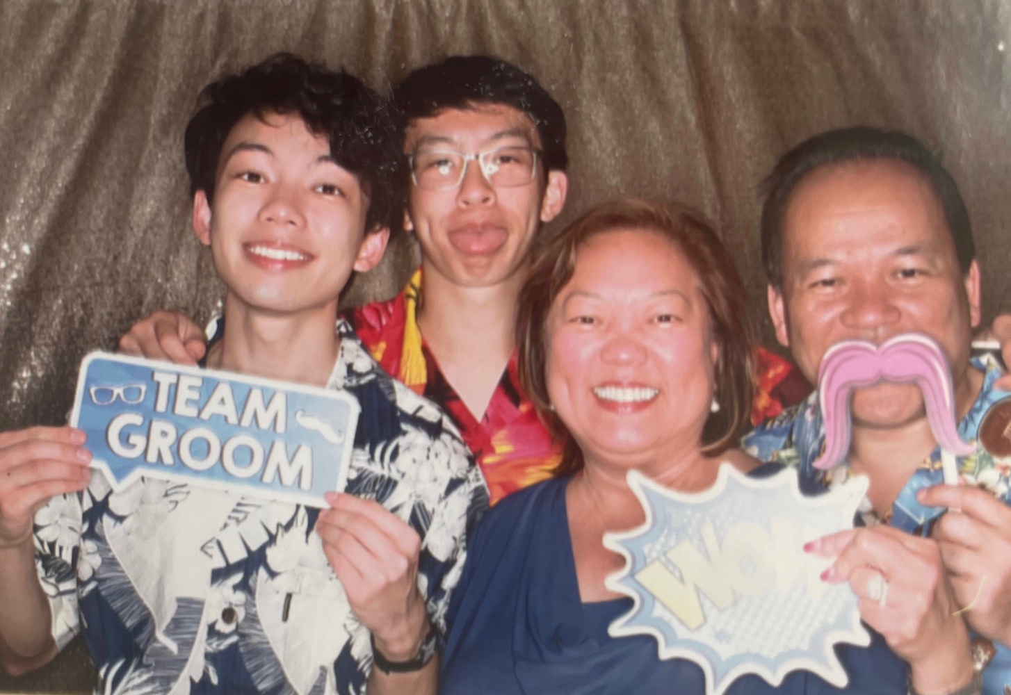 Ryan with his parents and younger brother, Alan, at a cousin’s wedding reception earlier this spring.