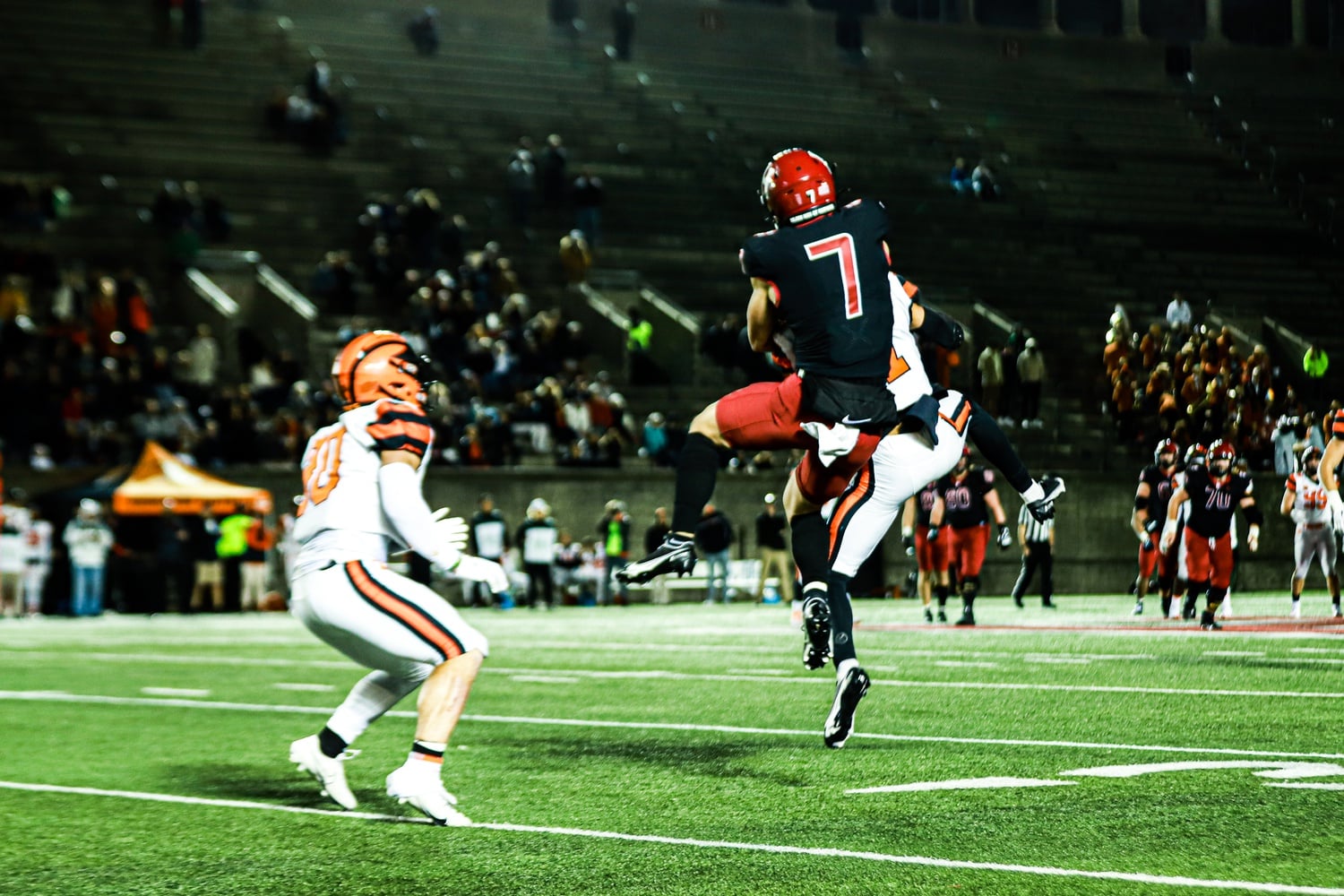 Junior wide receiver Kaedyn Odermann attempts to high-point a ball in the 37-10 loss to Princeton last Friday. Unfortunately for the Crimson, the play resulted in an interception.