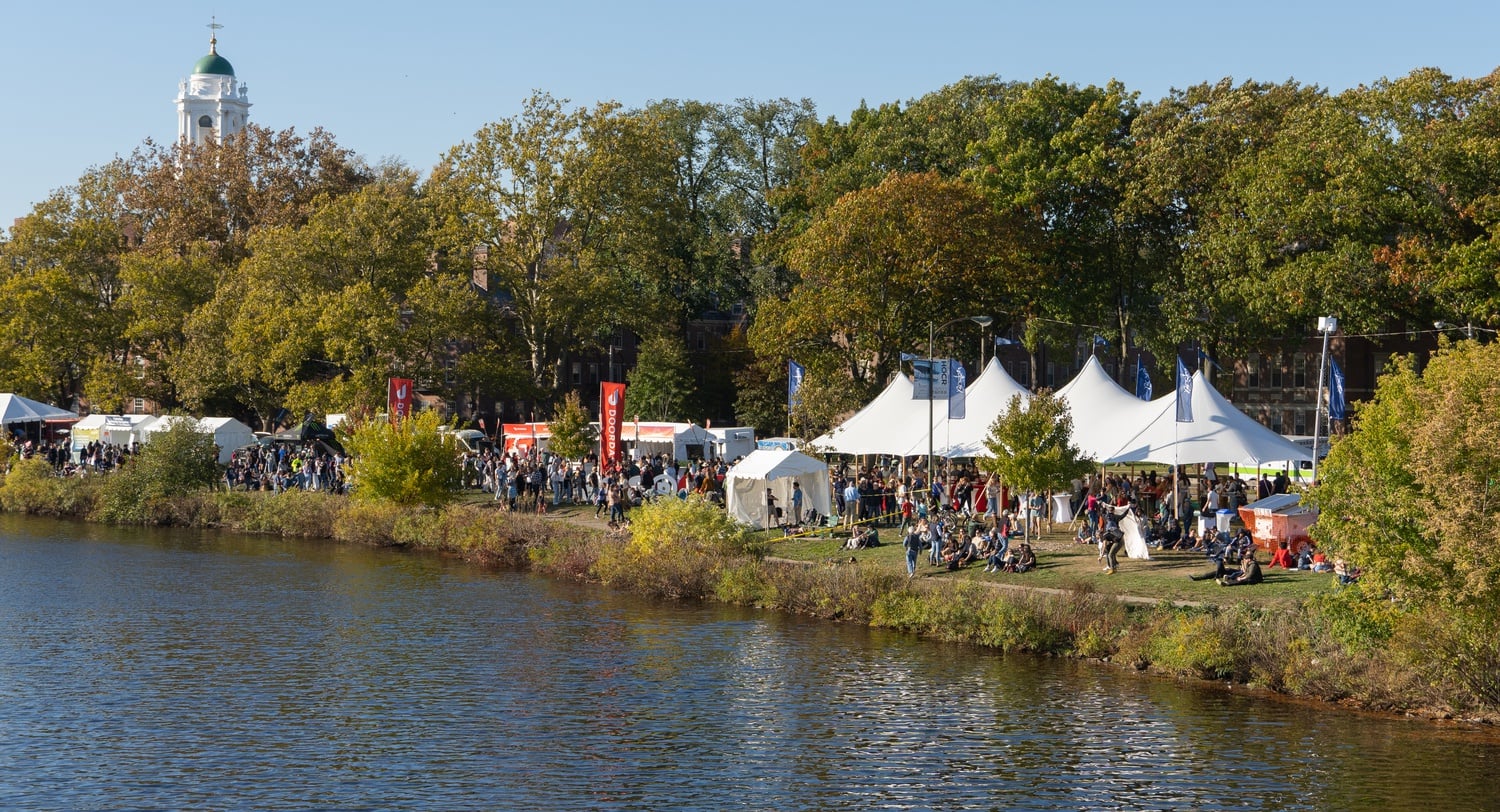 A large contingent of spectators – consisting of Harvard students, tourists, and rowing fanatics – line the banks of the Charles River during the 2022 Head of the Charles Regatta on Saturday.