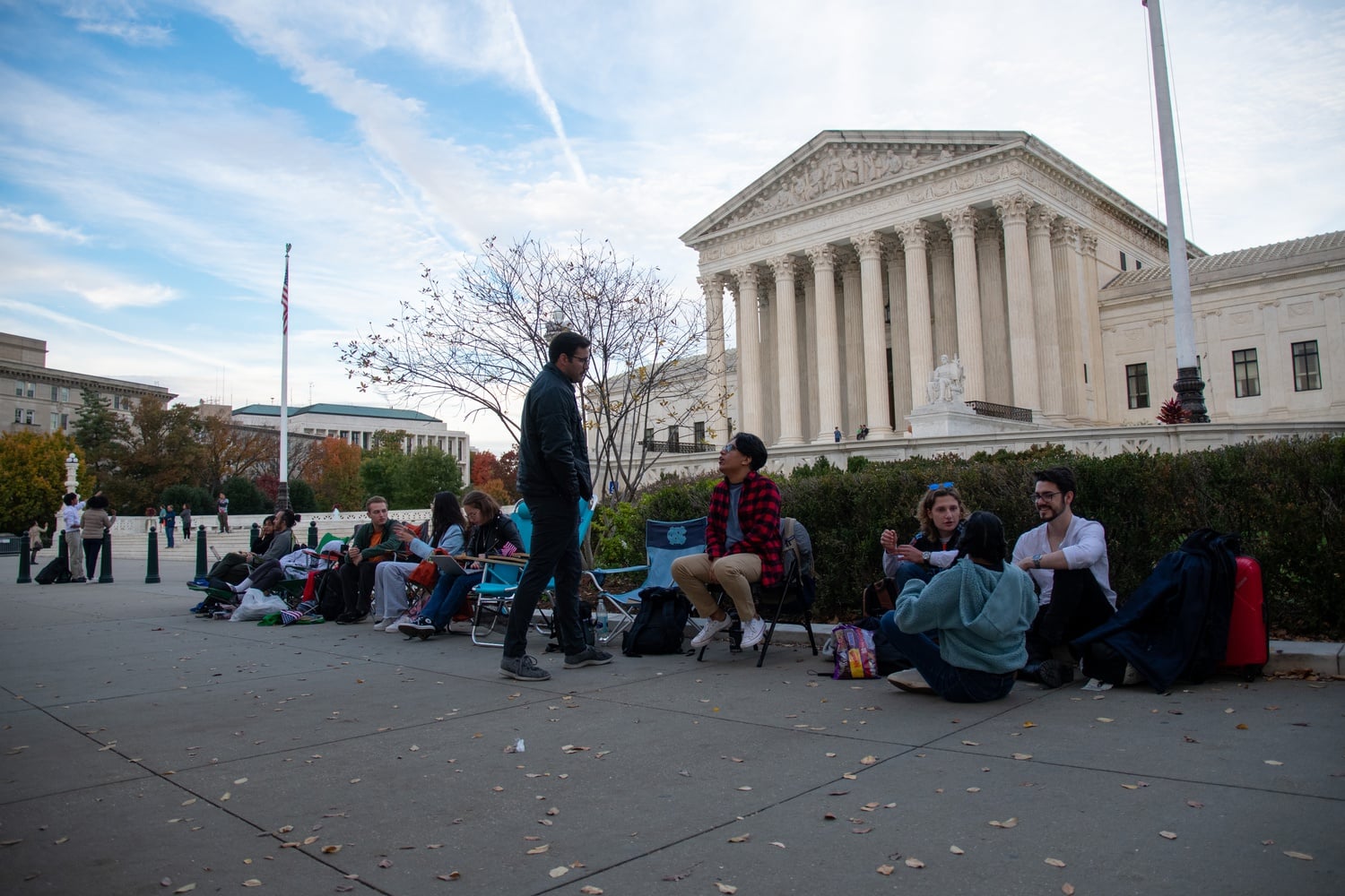 People camp outside of the Supreme Court building, hoping to secure seats inside to hear arguments in the affirmative action cases.