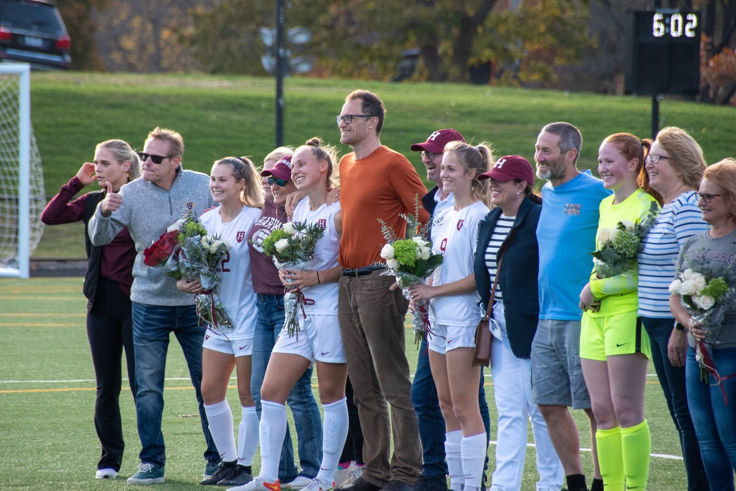 Seniors and their families line the field before the game before playing their final regular season game for the Crimson.