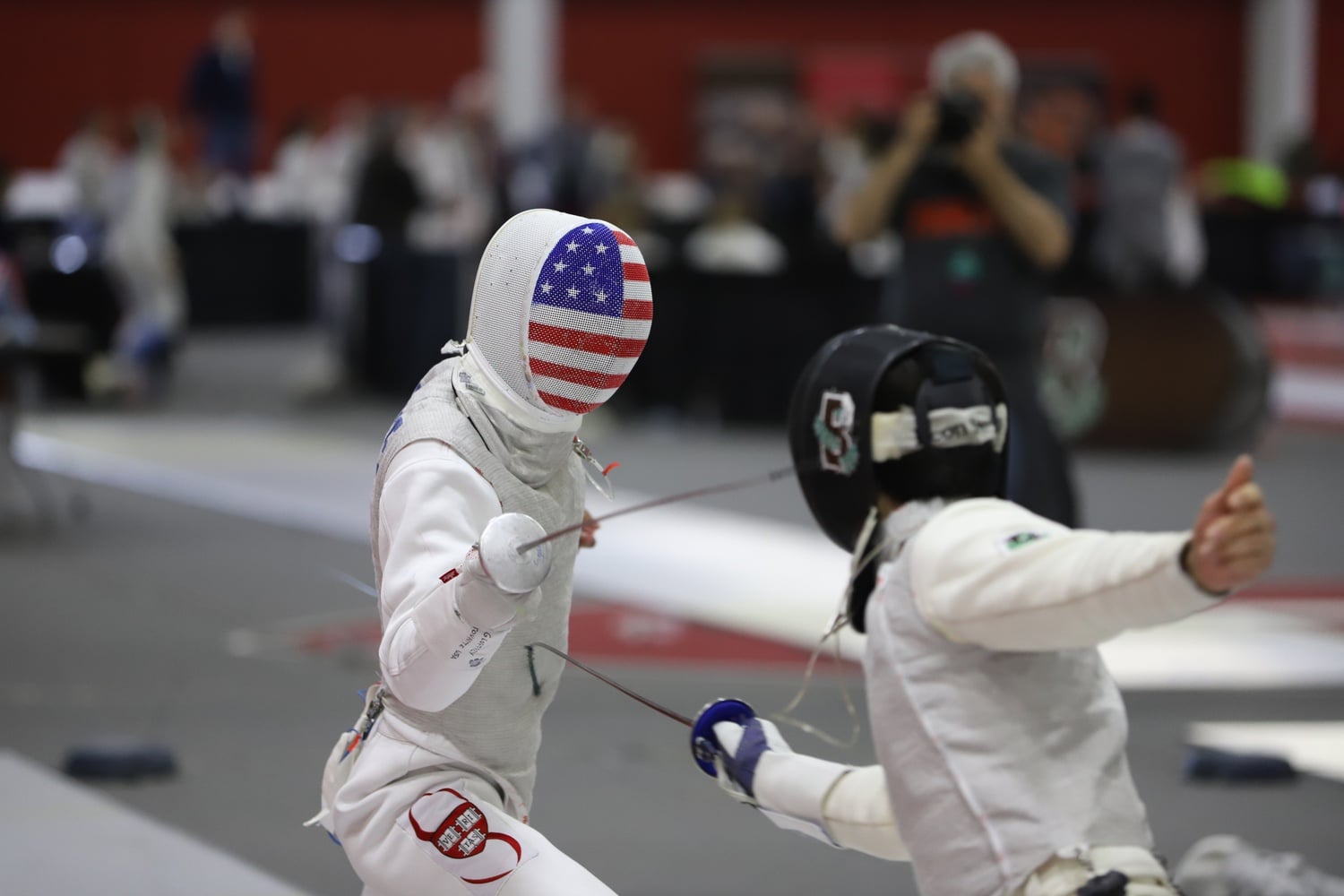 A Harvard fencer competes at the 2020 Ivy League Championships. The Crimson swept that tournament, extending a dominant run that has continued through at least the first tournament of the 2022-23 season.